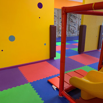 kids play area with colorful foam mats