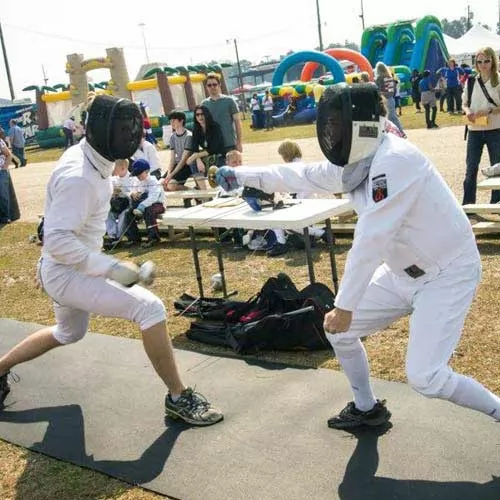 people fencing on rolled rubber flooring