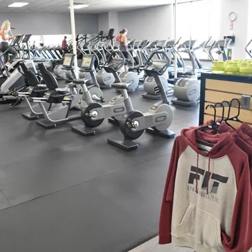 rubber flooring in gym with leg workout machines