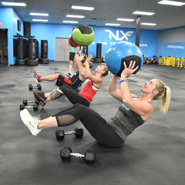 medicine ball exercise over 4x6 rubber fitness mats
