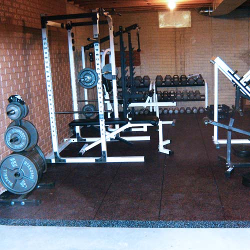 ultratile rubber weight reducers installed in basement home gym