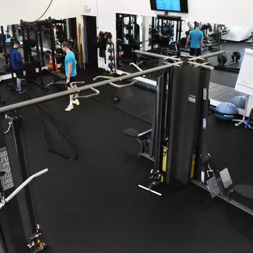 attractive rubber flooring in gym with workout machines