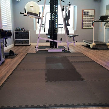 Foam home gym mats used on hardwood flooring