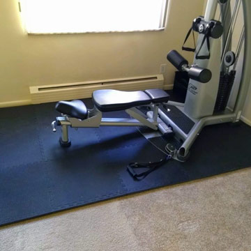 home gym floor mats with machine over carpet