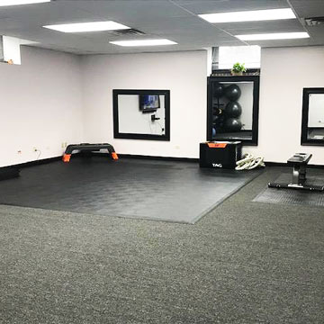 Large Basement Home Gym with Workout Flooring on Carpet