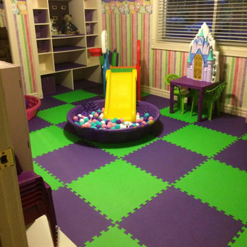 green and purple foam mats on hardwood flooring