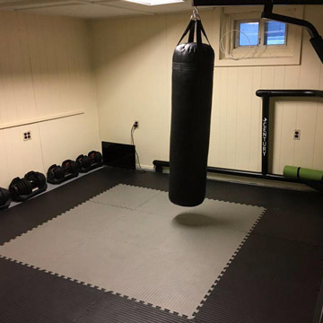 Home basement boxing ring workout area