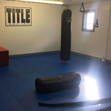 Home boxing areas with cushioned mat flooring