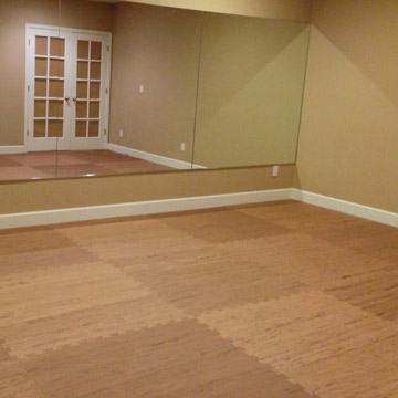 Home virtual workouts in basement on foam mat flooring