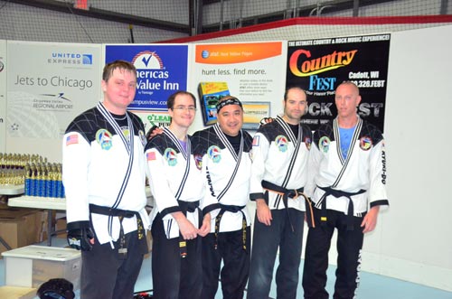 Reggie Madrigal with other Black Belts