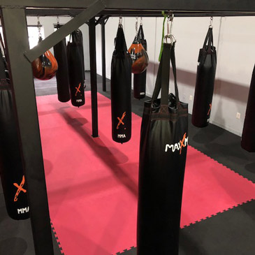 Punching bag workouts on cushioned foam flooring