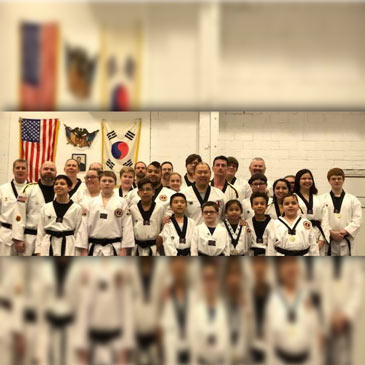 U.S. Taekwondo Academy black belts on puzzle mats