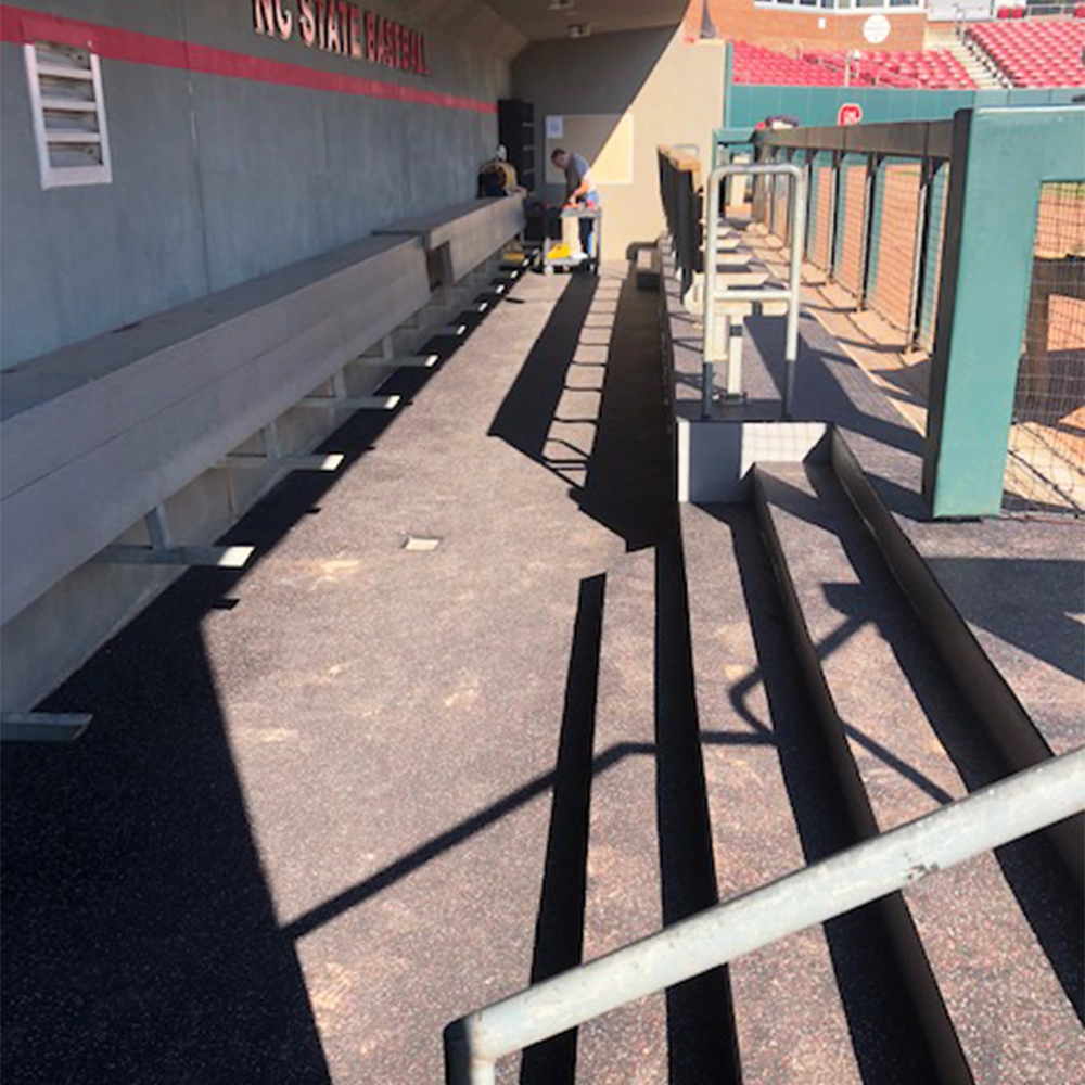 blade rolled rubber installed in baseball field dugout