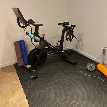 What Should I Use Under My Peloton Bike: Mats, Tiles & Rolls