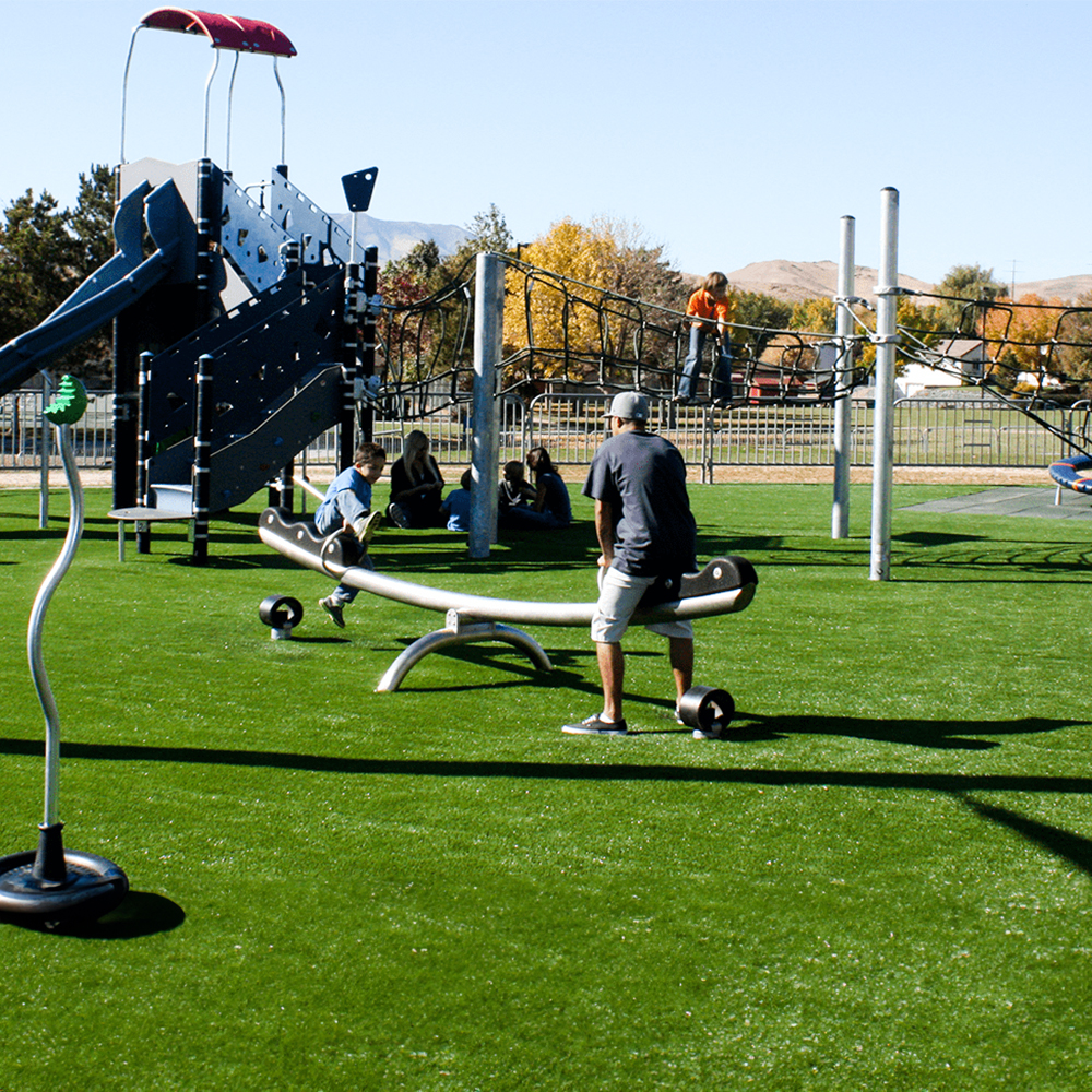 people playground on playground equipment with playground turf as surface