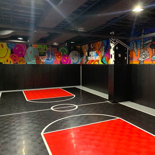Indoor sports court for basketball in basement