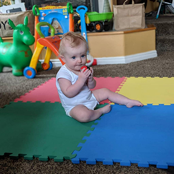 toddler barefoot on foam tiles