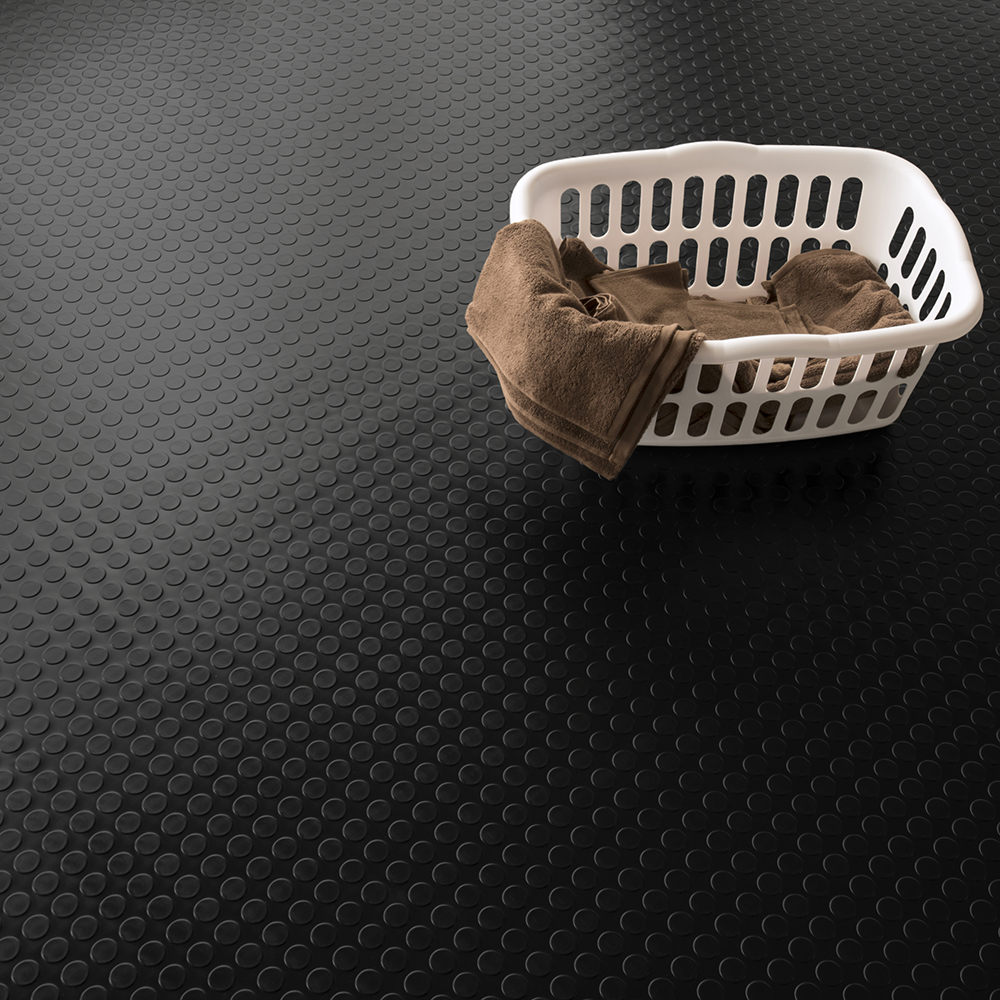 black coin top vinyl flooring in laundry room