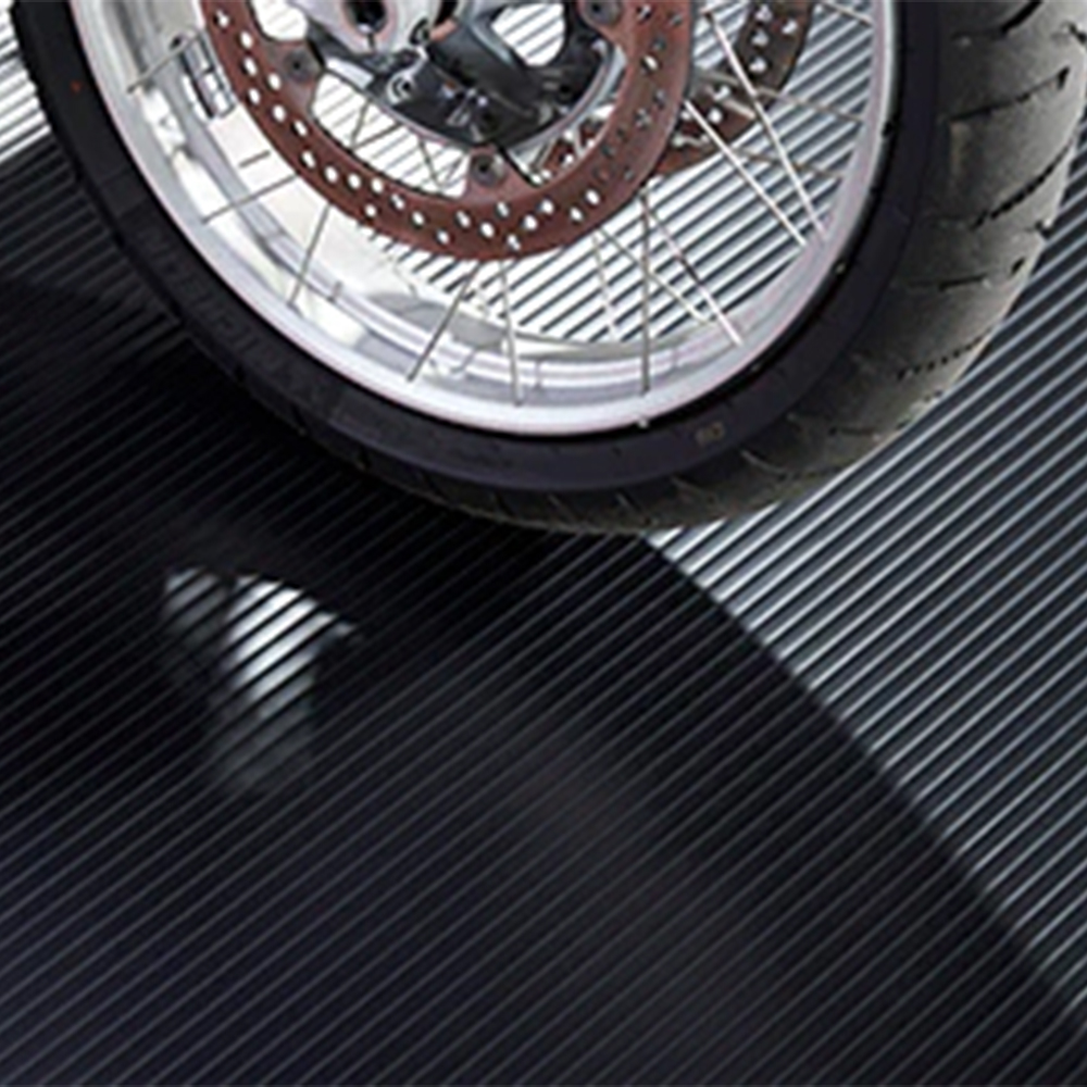 Motorcycle park on G-Floor Ribbed Tread Vinyl Multipurpose Roll 55 mil x 5x10 Ft. in midnight black