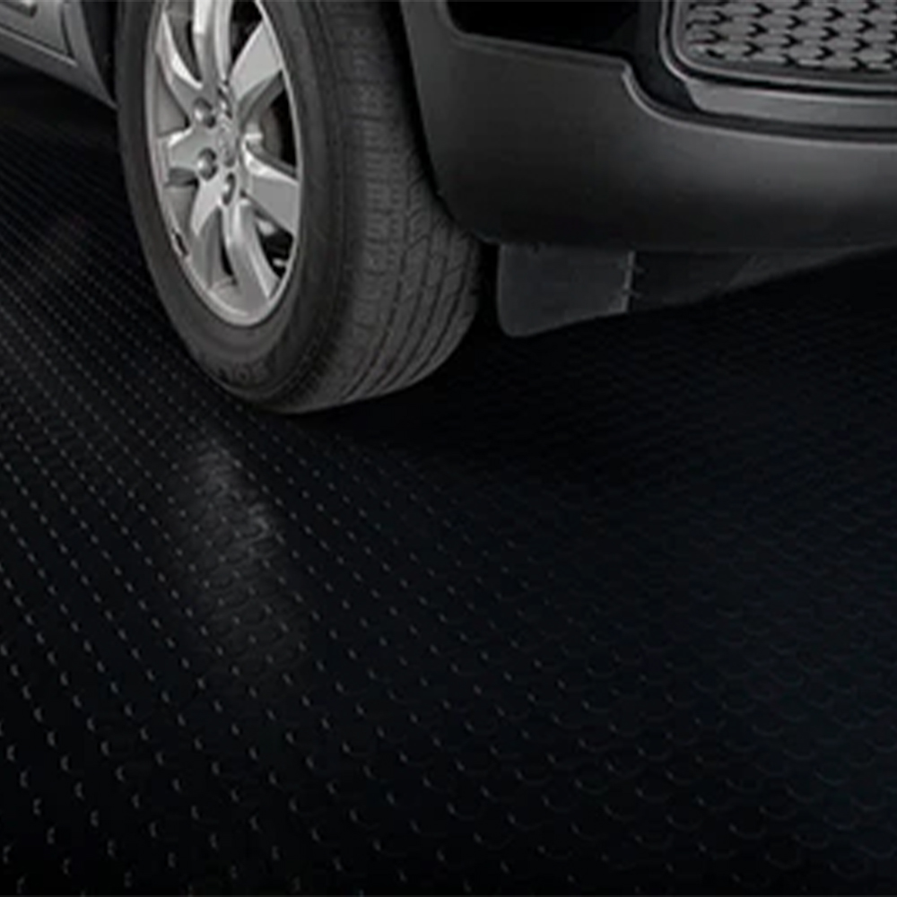 G-Floor Coin Tread Garage Floor Roll 75 Mil x 8.6x24 Ft. close up of car tire in midnight black