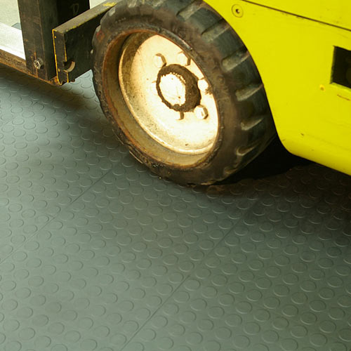 Garage Tile under heavy machinery