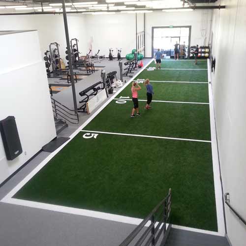 training on indoor turf at gym