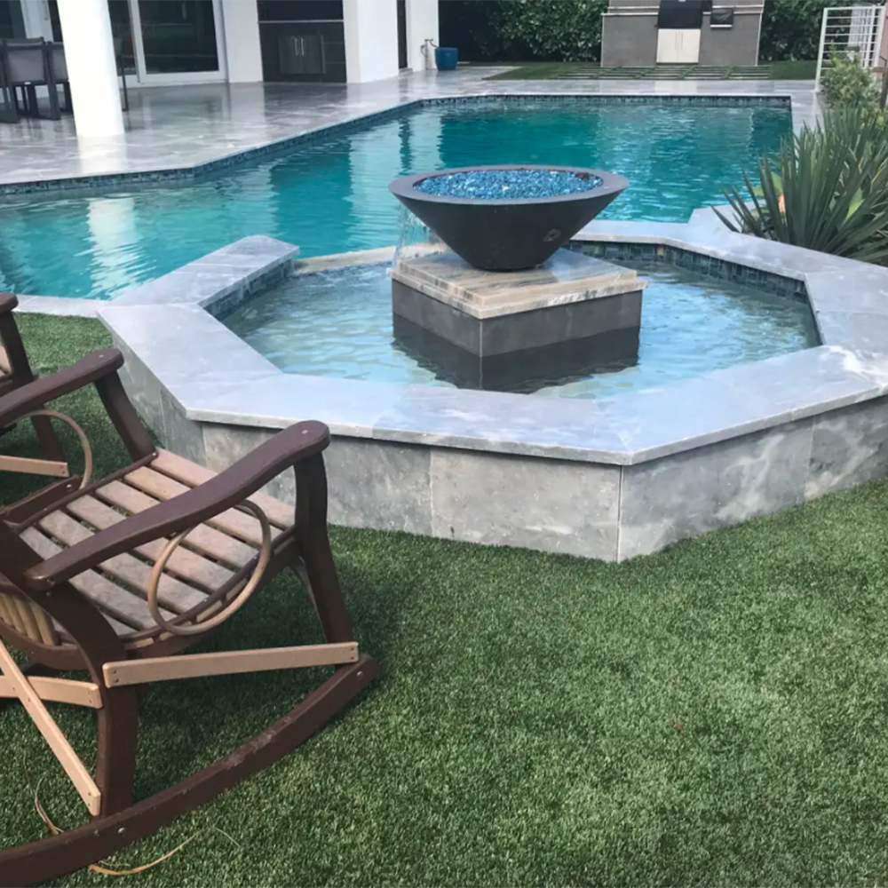 artificial turf installed around hot tub and pool deck