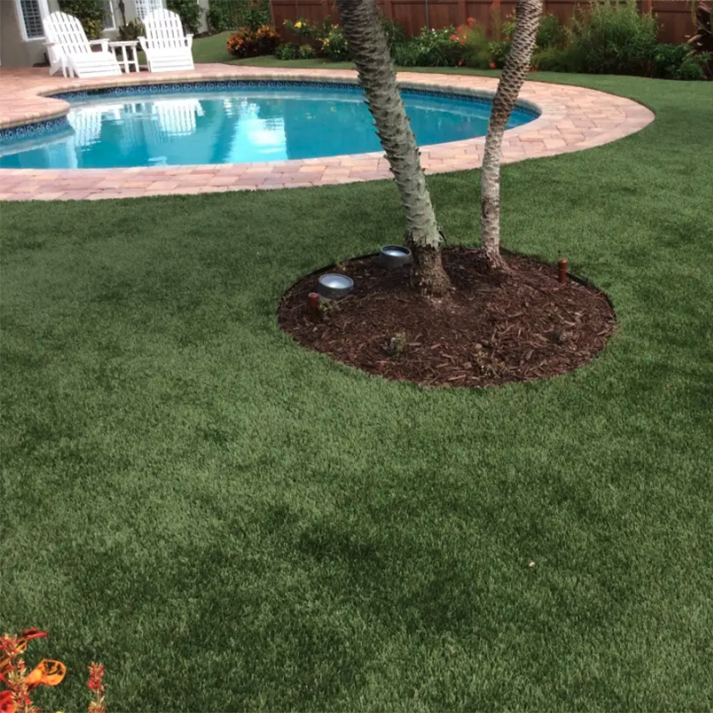 artificial turf installed around pool at residential outdoor pool