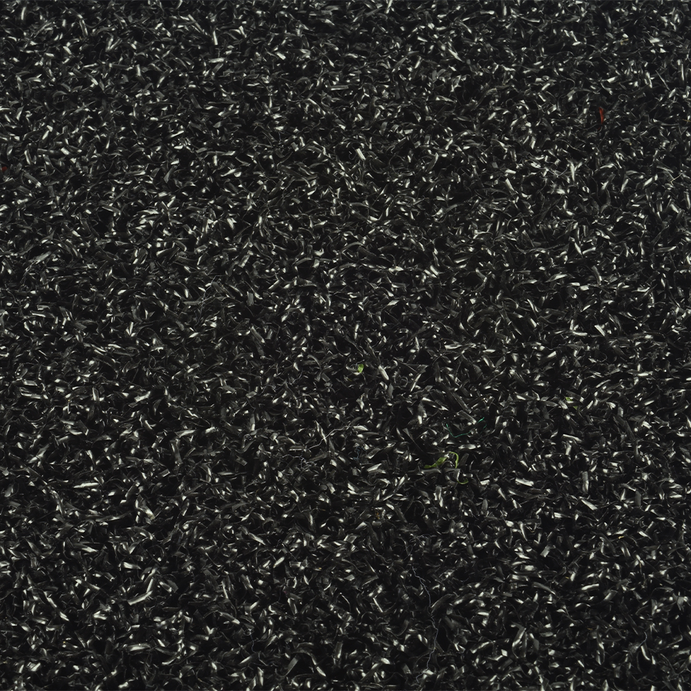 close up of black colored baseball home plate mat