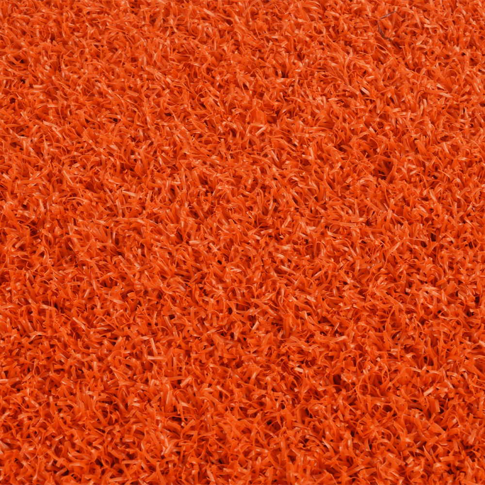 close up of orange colored baseball home plate mat
