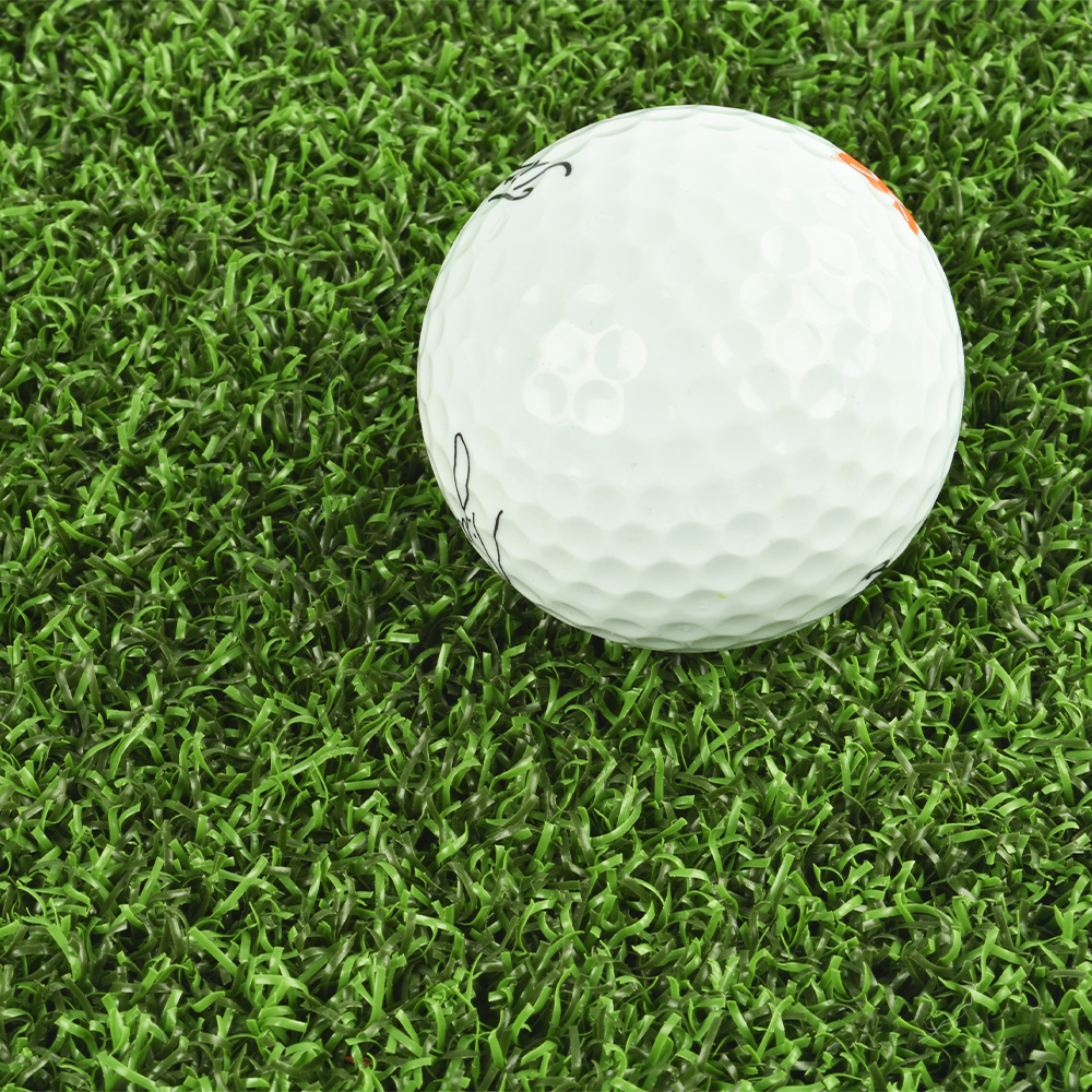 Bermuda Artificial Grass Turf 15 Ft x 5mm Padded per LF close up golf ball