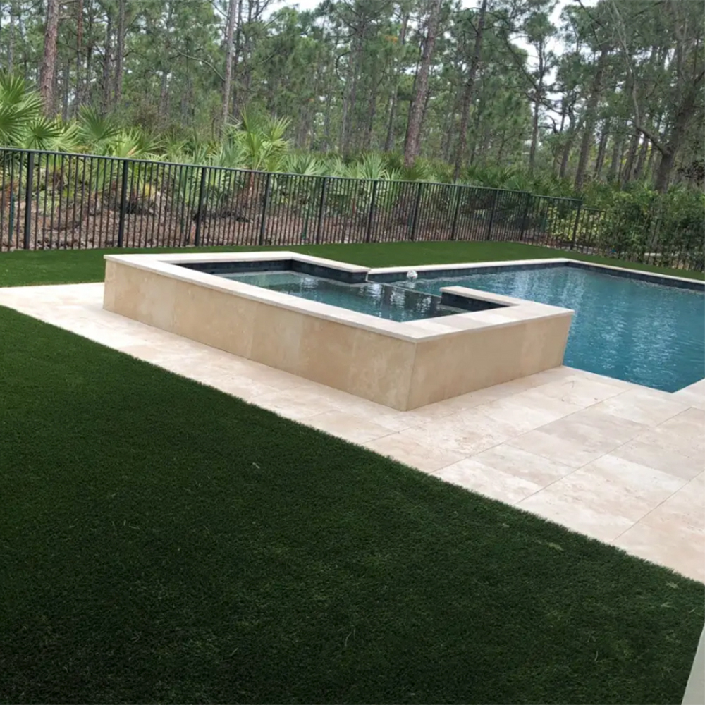 endless summer landscaping turf in backyard next to pool and hot tub area