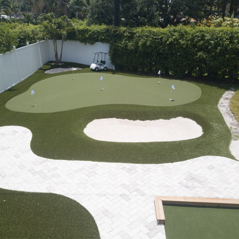 Troon Artificial Turf in backyard mini golf course featuring a putting and chipping area with sand trap