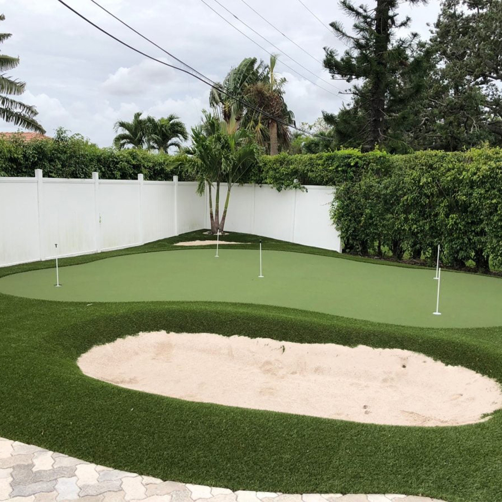 Troon Artificial Turf in backyard mini golf course featuring a putting and chipping area with sand trap