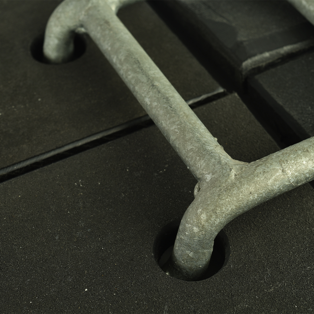 connector connecting four black ground protection mats