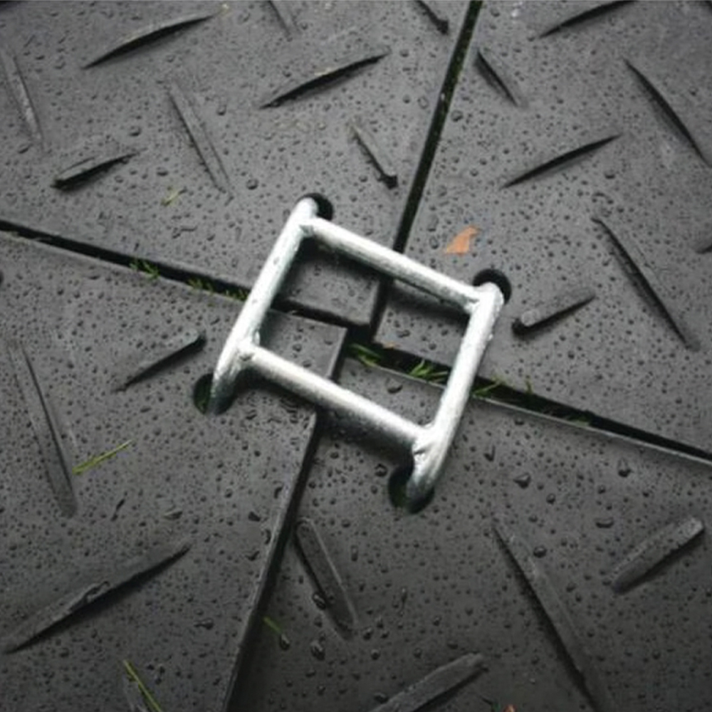 connector connecting four black ground protection mats
