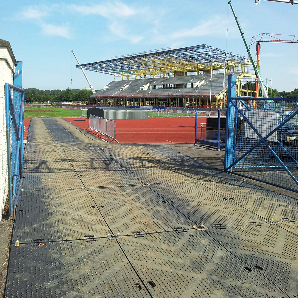 liberty ground protection mats over sports track at stadium