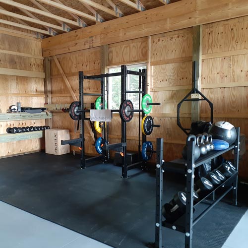 4x6 rubber mats installed in shed with home gym equipment
