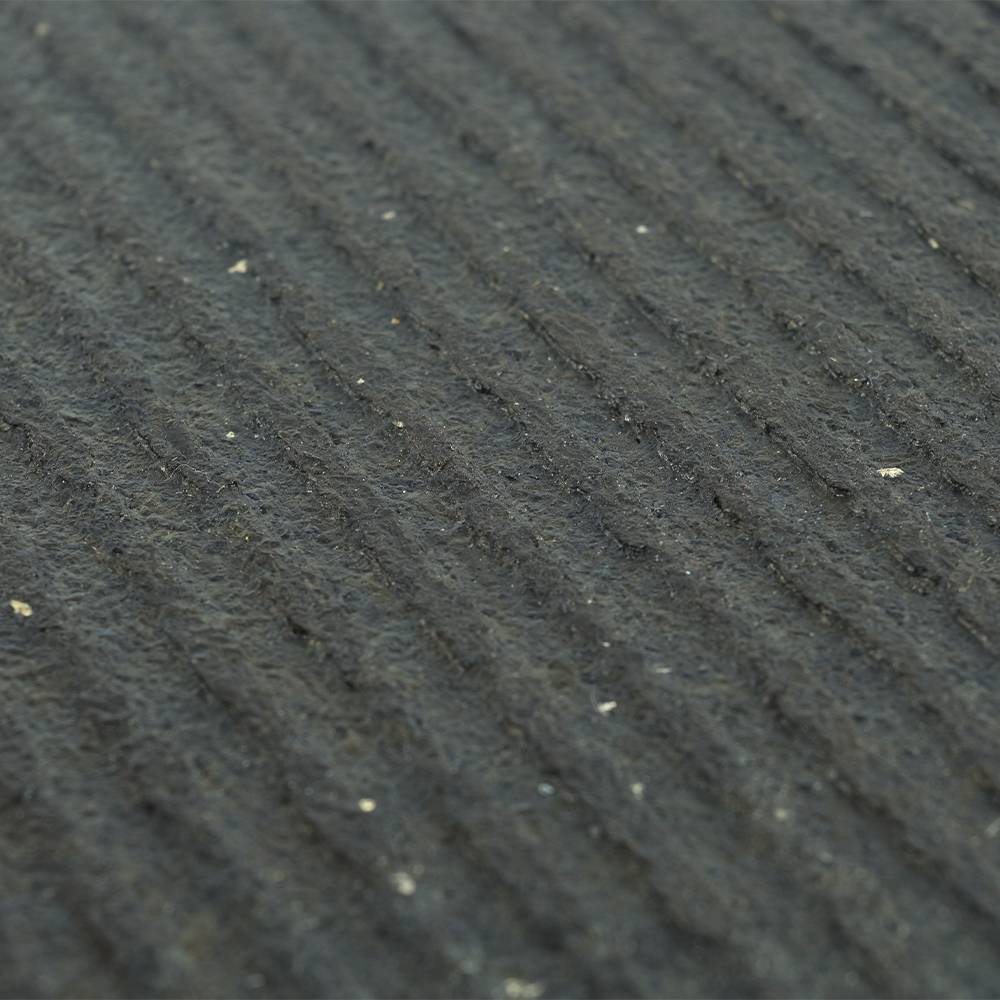 bottom texture close up of horse stall mat