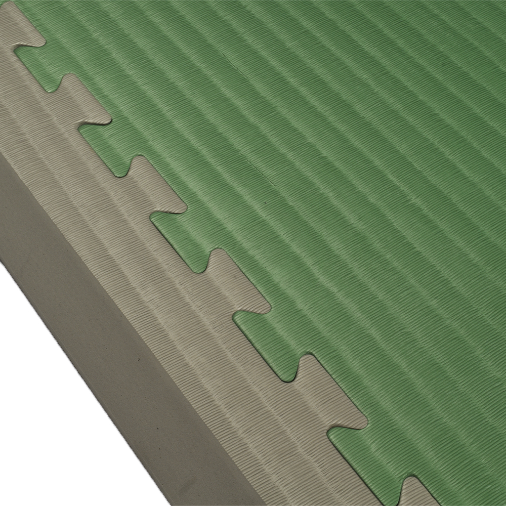 Side view of Border Ramp Pair for Indoor Playground Foam Tiles 1.5 inch x 1 Meter on green mat