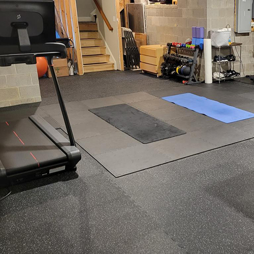basement gym with radiant heat uses rubber floor tiles