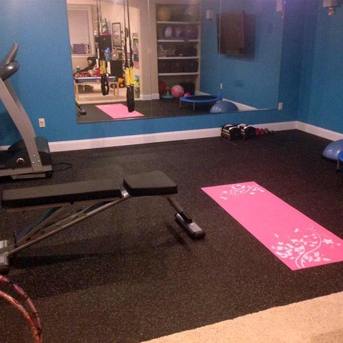 small exercise room with rubber tile floors