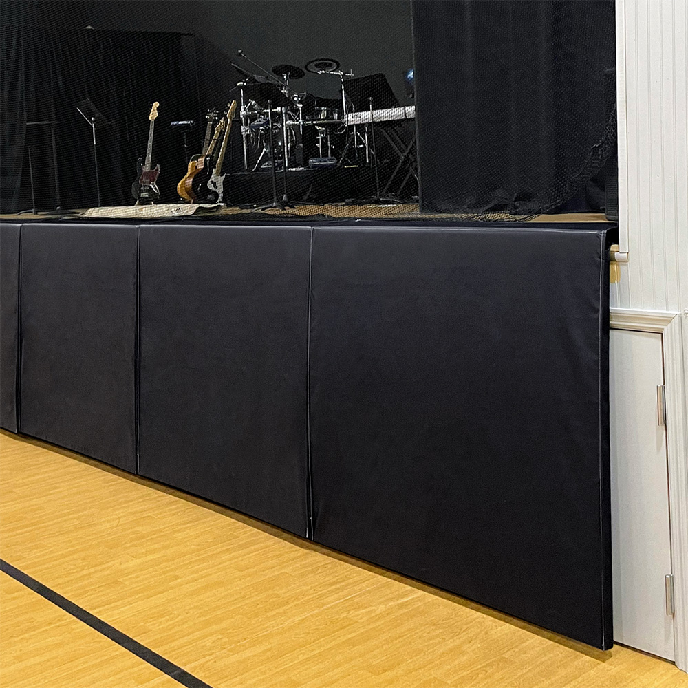 balck removeable stage padding in school gymnasium 