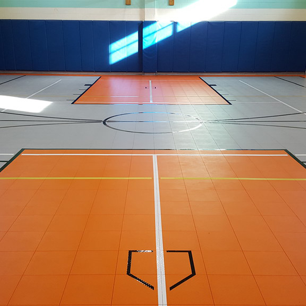 Recreation center with Indoor Court Tile Solid Surface 1/2 Inch x 1x1 Ft. in orange and gray