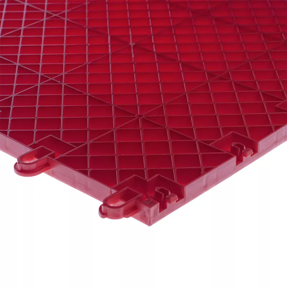 Raised plastic flooring tiles