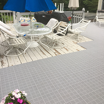 interlocking deck tiles over wood deck