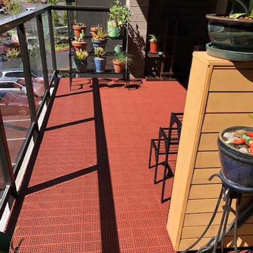 installed patio deck tiles over existing old decking