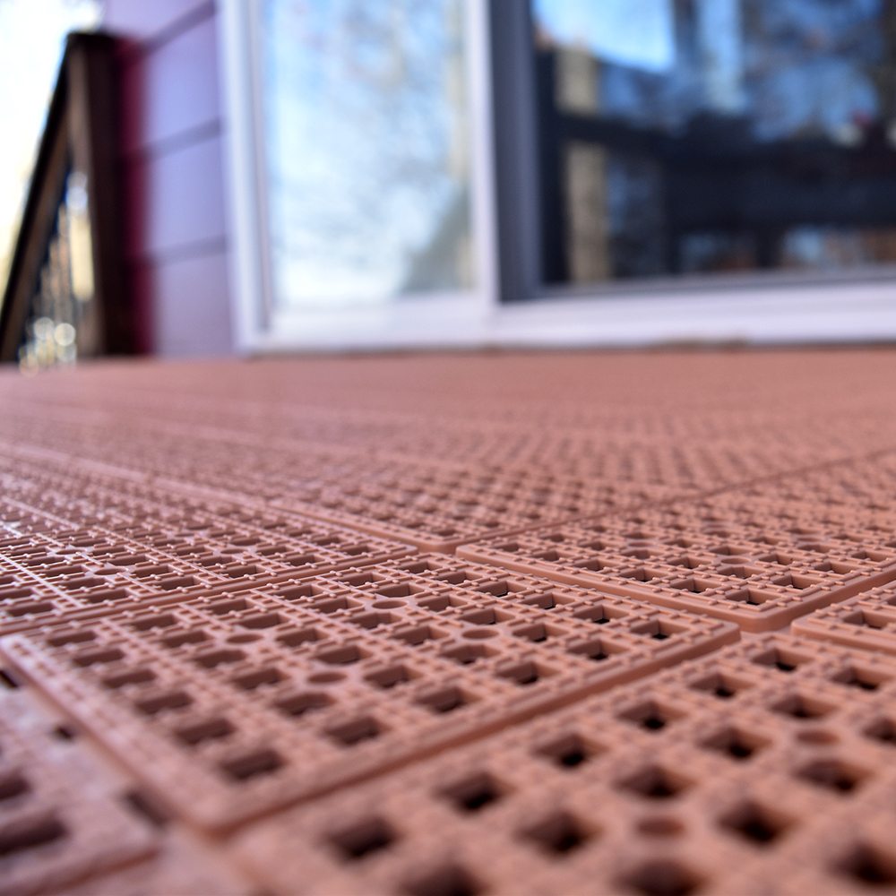 tan perforated deck floor tiles
