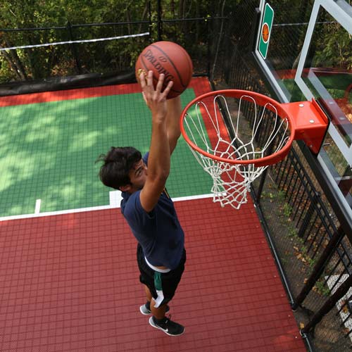 outdoor court self draining tiles on basketball court