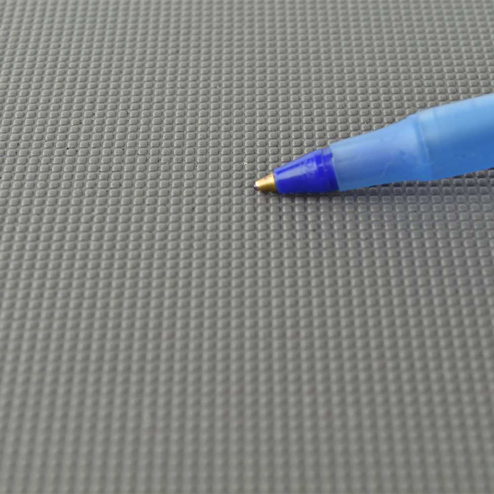 Comparing surface texture to pen tip of PaviGym Endurance Fitness Gym Flooring Tile 7 mm